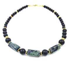 Adorn Yourself with this Unique and. Unisex African Green Jade & Onyx Choker/Necklace. Features: 16-24 Inches (Length Options) 8MM-12MM Genuine Onyx Gemstones 6MM-8MM Gold Hematite Gemstones 12MM Polygonal African Green Jade Hand Strung on Durable Nylon Wire 18k Lobster Clasp and Chain Closure (Non-Tarnish/HypoAllergenic) Tigers Eye Gem, Ankh Necklace, Green Jade, Earthy Colors, Jade Green, Chest Bag, Ring Bracelet, Lobster Clasp, Luxury Branding