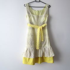 "Vintage Romantic Summer Dress Yellow Plaid Sleeveless Dress Elegant Checkered Dress Extra Small to Small Size Yellow Patterned Dress Estimated size: XS/S Measurements (lying flat): Shoulders: 13\"/ 33 cm Pit to pit: 16.5\"/ 42 cm Width: 14.5\"/ 36.7 cm Length total: 36\"/ 91.5 cm Condition: great Vintage Condition Handmade Please check measurements to insure a proper fit. Remember to allow yourself some extra room for movement. You can compare these with something from your closet that fits you well. This dress will come to you freshly laundered and ready to wear. Please convo me if you need additional measurements. SHIPPING * I ship worldwide via Priority mail (Latvijas Pasts) from Latvia (EU). * I ship from Europe, so please allow 2 to 4 weeks for the package to arrive if you live overs Vintage Sleeveless Patchwork Dress, Summer Sleeveless Cotton Dress With Patchwork, Yellow Fitted Sleeveless Cotton Dress, Summer Cotton Sleeveless Dress With Patchwork, Fitted Sleeveless Yellow Cotton Dress, Fitted Sleeveless Dresses For Picnic, Yellow Sleeveless Mini Dress For Picnic, Yellow Fitted Sundress For Picnic, Yellow Sleeveless Mini Dress For Picnics