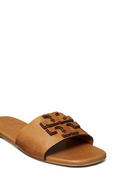 Dimensional logo detailing stands out atop the vamp of this laid-back leather slide sandal. Flat sole Leather upper, lining and sole Imported The Vamp, Leather Slide Sandals, Leather Slides, The Vamps, Sandal Women, Slide Sandals, Tory Burch, Womens Sandals, Leather Upper