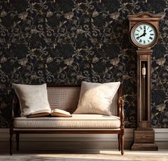 a clock on the wall next to a bench with pillows and a book in front of it