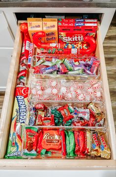 an open drawer filled with candy and snacks