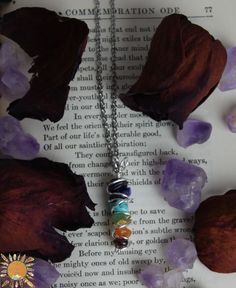 Small Chakra Pendant Hand wrapped, about 1.25" long, made with amethyst, lapis lazuli, turquoise, aventurine, citrine, carnelian, and garnet.  Chose from silver plated, gold plated, or copper.  Lobster Clasp Closure. ☽ ☾ A M E T H Y S T ☽ ☾ Balances the Crown Chakra.  Provides spiritual protection from psychic attacks and negative energy. ☽ ☾ L A P I S  L A Z U L I ☽ ☾ Balances the Third Eye Chakra. It is a stone for knowledge and intellectual ability. ☽ ☾ T U R Q U O I S E  ☽ ☾ Balances the Throat Chakra.  Helps aid in communication and provides protection. ☽ ☾ A V E N T U R I N E ☽ ☾ Balances the Heart Chakra.  Anti-Stress and Anti-Anxiety, known for good luck. ☽ ☾ C I T R I N E ☽ ☾ Balances the Solar Plexus Chakra.  Brings abundance , success, and good luck. ☽ ☾ C A R N E L I A N ☽ ☾ Ba Chakra Racine, Chakra Pendant, Chakra Necklace, Solar Plexus Chakra, Third Eye Chakra, Throat Chakra, Root Chakra, Hand Wrap, Crown Chakra