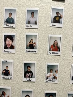 a wall that has pictures on it with people's names and numbers attached to them