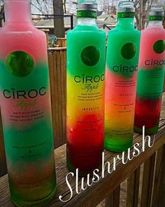 three bottles of ciroc are sitting on a wooden railing with the words sushiwash in front of them