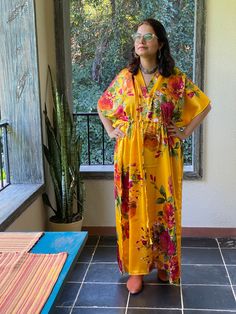 I made this Kaftan from a beautiful floral pattern in satin silk fabric. It is very soft with a nice flowy feel to it making you feel as if you are not wearing anything. It is so free flowing, that it will make you feel as if you aren't wearing anything at all ;) The beauty of the Kaftans is they will fit everyone so no need to worry about the size et all. All my Kaftans have deep necks(11-12 inches) so will fit all head sizes. However, the length of my kaftans will vary. I make all my kaftan st Festival Silk Kaftan With Floral Print, Multicolor Silk Robe For Vacation, Traditional Yellow Kaftan With Floral Print, Summer Festive Floral Print Kaftan, Festive Summer Floral Print Kaftan, Yellow Kaftan With Kimono Sleeves For Spring, Yellow Spring Kaftan With Kimono Sleeves, Festive Beach Kaftan With Kimono Sleeves, Festive Long Kimono For Vacation