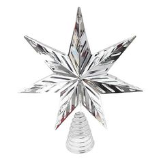 a clear glass star ornament on a white background