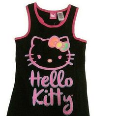 This Hello Kitty Tank Top Is A Must-Have For Any Fan Of The Adorable Feline. The Black Racerback Design Is Perfect For Everyday Wear, And The Glitter Accents Add A Touch Of Sparkle To Any Outfit. Available In Multiple Sizes, Including Xs And L, This Top Is Ideal For Women Of All Sizes. The Brand Is Well-Known For Its Quality Products, And This Tank Top Is No Exception. Whether You're Lounging At Home Or Out Running Errands, This Top Is Sure To Keep You Comfortable And Stylish. Y2k Black Hello Kitty Print Top, Black Sleeveless School Top, Cute Black Tops For School, Cute Black Cotton Tank Top, Fitted Black Hello Kitty Top, Fitted Black Hello Kitty Print Top, Fitted Black Top With Hello Kitty Print, Playful Black Tops For School, Sparkly Tank Top