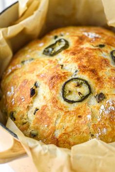 a close up of a bread in a pan with some sort of food inside it