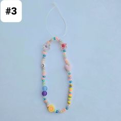 the necklace is decorated with colorful beads