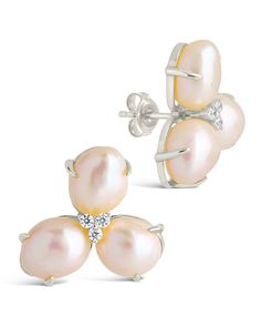 Presenting the Olive Pearl Studs, delicate and timeless earrings made of luminous pearls and clear CZ stones embedded in a stylish stud setting. These earrings, a must-have piece of luxury jewelry, will add a sophisticated sparkle to any outfit. Material: 14K gold or rhodium plated brass, cubic zirconia, shell pearl Features: 0.75" stud, 1mm CZ stones, 11mm pearls, Lead & Nickel free, post back Evening Pearl Earrings With Cubic Zirconia, Silver Feminine Earrings With Pearl Charm, Feminine Pearl Earrings In Silver, Feminine Silver Earrings With Pearl Charm, Silver Feminine Pearl Earrings For Anniversary, Feminine Silver Pearl Earrings, Feminine Silver Pearl Earrings For Anniversary, Evening Pearl Earrings In Diamond White, Glamorous Pearl Embellished Earrings As Gift