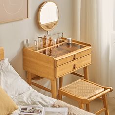 a bedroom with a vanity and mirror on the wall