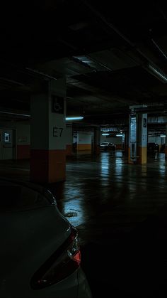 an empty parking garage at night with no one in the car park or waiting for their turn