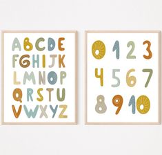 two framed art prints with numbers and letters on them, one in gold and the other in blue