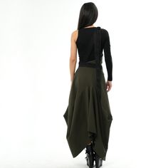 This beautiful avant garde skirt is what dreams are made of with its futuristic silhouette and front extra material that ends in two ties that are tied together on the back. The item closes with a hidden zipper on the side, it does not have pockets. Gorgeous contemporary military green color. MATERIAL: Punto Di Milano- heavy knitted fabric (65% viscose, 30% polyamide and 5% elastane).  Made of 100% deadstock fabric. Using deadstock fabrics helps us to reduce textile waste.  CARE: Wash at 30 degr Avant Garde Skirt, Pinafore Skirt, Deadstock Fabric, Textile Waste, Green Jumpsuit, Jumpsuit Skirt, Handmade Brand, Independent Designers Fashion, Military Green