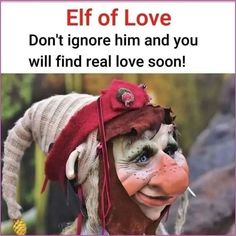 a clown with his face painted red and wearing a hat that says elf love don't ignore him and you will find real love soon