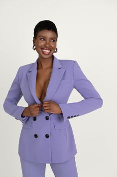 Following our core concept of women's empowerment, we aimed to incorporate the ultimate feminine power suit. Our Kris ensemble consists of a tailored double-breasted blazer with a slim fit and a nipped-in waist, coordinated with straight-leg tailored trousers featuring pressed pleats for a streamlined look. The power factor lies in the sharp shoulders with peaked lapels of the blazer. It also includes pockets on each side and on the wearer's left chest at the front, along with buttoned cuffs at Fitted Double-breasted Structured Blazer, Fitted Double-breasted Suits For Work, Fitted Double-breasted Office Suits, Fitted Pantsuit With Double Button Closure And Suit Collar, Fitted Double-breasted Pantsuit For Business, Fitted Double Breasted Suit With Suit Collar For Career, Fitted Structured Double-breasted Suits, Fitted Double-breasted Pantsuit For Office, Fitted Double-breasted Pantsuit