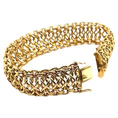 This stunning Italian gold bracelet has the look and feel of pure luxury! Beautifully interwoven links of high-polished 18k yellow gold create wonderful visual and actual movement, in an ultra-comfortable design that makes this bracelet a pleasure to wear! It is a gorgeous piece with substantial weight that will make you feel both elegant and confident every time you put it on! With the ability to transition effortlessly between everyday wear and special occasions, this is a beautiful signature Luxury Adjustable Yellow Gold Bracelet, Luxury Yellow Gold Rondelle Bracelet, Luxury Yellow Gold Rectangular Bracelets, Luxury Ornate Gold Bangle Bracelet, Luxury Fusion Style Yellow Gold Jewelry, Luxury Yellow Gold Sterling Silver Classic Bracelet, Luxury Yellow Gold Ornate Bracelet, Luxury Rectangular Gold-tone Jewelry, Luxury Yellow Gold Bracelet With Clasp