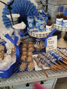 a table topped with lots of food and desserts