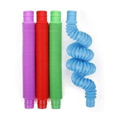 three different colored plastic tubes next to each other