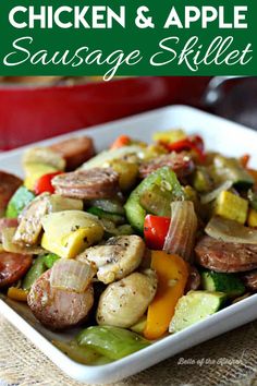 a white plate topped with sausage and veggies