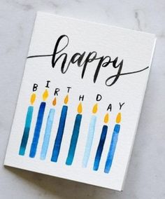 a birthday card with candles on it and the words happy birthday written in black ink