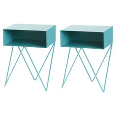 two green side tables sitting next to each other