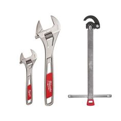 two wrenches and a pair of pliers on a white background