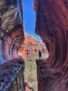 a man standing on the edge of a canyon