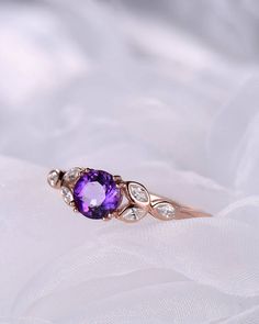 A 1 carat 6mm round Cut Natural Amethyst ring Accent stones: white CZ The stones of the ring can be replace with other different kinds of gemstone such as morganite, aquamarine, amethyst, citrine, white CZ, pink CZ,etc. If you want to customize your own personal ring, please feel free to contact with me. (925 sterling silver white/yellow/rose gold plated or solid 14k white/yellow/rose gold are available) 14 days money back guarantee. Amethyst Diamond Ring In Yellow Gold For Wedding, Gold Amethyst Ring With Brilliant Cut For Wedding, Wedding Amethyst Ring In Yellow Gold With Diamonds, Yellow Gold Amethyst Ring With Center Stone For Wedding, Gold Brilliant Cut Amethyst Ring For Wedding, Yellow Gold Amethyst Ring With Diamonds For Wedding, Brilliant Cut Gold Amethyst Ring For Wedding, Purple Cubic Zirconia Birthstone Ring, Wedding Yellow Gold Amethyst Ring With Diamonds