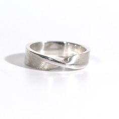 Sterling Silver Mobius Ring Modern Sterling Silver Open Band, Minimalist Twisted Jewelry For Anniversary, Sterling Silver Minimalist Ring, Minimalist Sterling Silver Concave Ring, Modern Sterling Silver Bands, Minimalist Sterling Silver Jewelry With Concave Shape, Minimalist Sterling Silver Bands For Formal Events, Minimalist Sterling Silver Bands For Formal Occasions, Modern Twisted Sterling Silver Jewelry