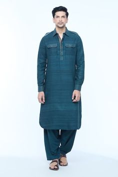 Teal blue full sleeves Pathani style kurta crafted in handloom silk with all over textured lines detailing and stitchlines on the collar, cuffs, placket and pocket flaps. Paired with a salwar. - Aza Fashions Festive Kurta With Button Cuffs, Blue Cotton Silk Long Sleeve Sherwani, Traditional Cotton Kurta With Button Cuffs, Long Sleeve Cotton Silk Kurta With Handloom Details, Blue Handloom Straight Kurta, Blue Handloom Kurta, Traditional Long Sleeve Handloom Sherwani, Men Kurta, Plain Blue