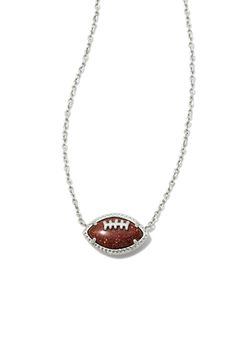 Cheer on your favorite team with the Kendra Scott Football Short Pendant Necklace in Silver! Featuring an adorable football pendant and dainty silver chain, this is the perfect layering necklace! This necklace is the perfect fall accessory! Features: Kendra Scott Style: 9608865358 Color: Silver Women’s Necklaces 14k Silver Plated Spring ring clasp closure Kendra Scott Necklace Hypoallergenic 19" chain, 0.68"L X 0.41"W foot ball pendant Cheer Accessories Ideas, Dr Accessories, Football Necklace, Short Pendant Necklace, Foot Ball, Kendra Scott Necklace, Jewelry Aesthetic, Jewelry Accessories Ideas, Accessories Ideas