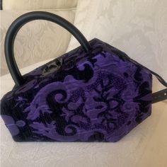 Widow Coffin Satchel Shoulder Bag Purse Brand New With Tag Limited Edition Soft Brocade Exterior Structured Coffin Shaped Bag, Keeps Its Shape, Isn’t Pliable Purple And Black Snap Lock Latch Closure Removeable Shoulder Strap Satchel Carrying Handle Lined Black Interior Vegan Leather Strap & Trim 9” X 7” All My Items Are Guaranteed Authentic Smoke Free Home Purple Shoulder Bag With Detachable Handle For Evening, Purple Evening Shoulder Bag With Detachable Handle, Evening Purple Shoulder Bag With Detachable Handle, Evening Purple Shoulder Bag With Top Carry Handle, Purple Top Handle Bag For Formal Occasions, Formal Purple Shoulder Bag With Removable Pouch, Formal Purple Top Handle Bag, Purple Shoulder Bag With Detachable Handle As Gift, Purple Evening Bags With Removable Pouch