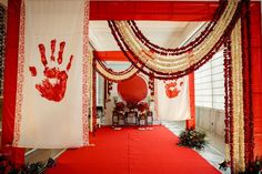 a red and white wedding decorated with hand prints