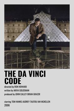 a man sitting on top of a glass table in front of a building with the words'the da vinci '