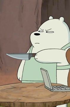 a cartoon bear sitting at a table with a knife in his hand and a laptop on it