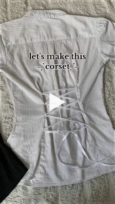 a white shirt with the words let's make this corset