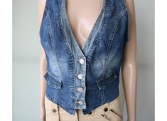 Women's Blue Denim Vest Sleeveless Top Medium Size > Tag : orsey > 99% Cotton, 1% Elastane > False pockets Condition : Good Vintage Condition NOTE : Actual colors may vary. This is due to the fact that every monitor has a different capability to display colors and that everyone sees these colors differently. PLEASE, look the actual measurements in description which are taken by hand and thus show the actual size. Measurements (laying flat): Length : 50 cm / 19.7''  Armpit to armpit : 48 cm / 18.9'' Waist : 41 cm / 16.1'' Please check measurements to insure a proper fit. Remember to allow yourself some extra room for movement. You can compare these with something from your closet that fits you well. Summer Blue Denim Vest, Stretch Medium Wash Sleeveless Denim Vest, Stretch Denim Vest With Pockets For Summer, Summer Stretch Denim Vest With Pockets, Stretch Medium Wash Denim Vest With Pockets, Vest Outfits, Red Shirt, Western Outfits, Denim Vest