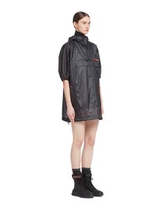 Find PRADA Ripstop Hooded Raincoat on Editorialist. LR–LX047 Ultra-light 3-layer micro ripstop that is highly waterproof and windproof Regular fit Hood Short sleeves with elasticized trim Waxed zipper closure Vertical waxed zipper pockets Regular shoulder Elasticized drawstring on the hood and hem Unlined Heat-sealed tape seams Latex logo label Large horizontal pocket with flap and waxed zipper Laser-cut perforations on the back under the yoke and around the armhole Heat-transfer labels inside under the pockets Waxed zippers on the sides Functional Nylon Raincoat For Rainy Season, Functional Windbreaker With Detachable Hood For Rainy Season, Winter Nylon Windbreaker With Storm Flap, Nylon Parka For Rainy Season Outdoor Use, Nylon Parka For Rainy Outdoor Season, Nylon Parka For Rainy Season Outdoor Activities, Nylon Parka With Adjustable Hood For Rainy Weather, Rainy Season Outdoor Nylon Parka, Black Nylon Raincoat With Detachable Hood