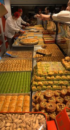 many trays of food that are on display