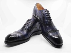 Style: 5817-1233A-Navy Exclusively for C & E, this Completely Handmade, Hand Burnished Genuine Alligator lace-up oxford from the Ugo Vasare collection features Goodyear Welted construction, soft Calfskin lining, a Cap Toe, Decorative Perforations with Pinking Detail, a stitched welt and a full Leather sole! Please note: Some sizes are on Back Order. Cordovan Shoes, Shoe Horn, Shoe Tree, A Cap, Goodyear Welt, Horse Hair, Suede Shoes, Shoe Box, New Shoes