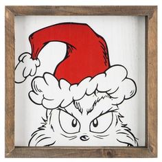 a drawing of a cat with a santa hat on it's head in a wooden frame