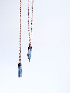 "Kyanite crystal necklace | Raw kyanite jewelry | Kyanite crystal pendant | Blue kyanite pendant | Rough kyanite jewelry | Kyanite necklace This listing is for one small kyanite crystal electroformed and strung on an 18\" copper chain. Our jewelry is unique and one-of-a-kind. Please note there will likely be variances in the size, shape and color of each stone. All elements of your piece are handcrafted in our tiny studio on the island of Martha's Vineyard. Your jewelry will arrive ready for gif Jewelry Witchcraft, Kyanite Necklace, Rough Quartz, Kyanite Jewelry, Kyanite Crystal, Raw Gemstone Jewelry, Raw Crystal Necklace, Quartz Crystal Pendant, Crystals Jewelry