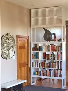 a living room with a book shelf filled with books