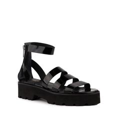 These edgy flatform sandals feature a lug sole and strappy caged silhouette in high-shine patent leather. With a comfy lightweight EVA platform outsole and easy access back zipper, they’re the perfect choice for every occasion under the sun (and moon!). Available in Vacchetta, Cucumber, and Black Patent Leather. Heel H Edgy Chunky Platform Summer Sandals, Edgy Chunky Platform Sandals For Summer, Edgy Spring Sandals With Chunky Platform, Edgy Chunky Platform Sandals For Spring, Edgy Spring Platform Sandals, Black Sandals With Lug Sole For Spring, Summer Chunky Platform Sandals In Patent Leather, Summer Platform Sandals In Patent Leather, Summer Patent Leather Platform Sandals