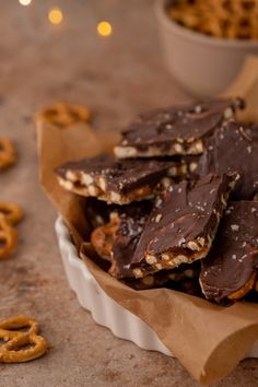 chocolate pretzels are stacked on top of each other in a paper wrapper