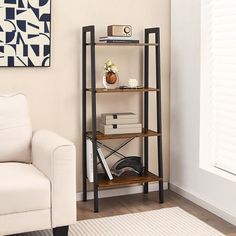 a living room with a white chair and bookshelf