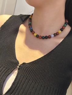 This vibrant Colorful Gemstone Bead Necklace is a stunning piece that adds a playful yet sophisticated touch to any outfit. The array of natural gemstone beads in various colors creates a bold and beautiful look, making it a versatile accessory for both casual and formal occasions. With a secure gold-toned clasp, this necklace is a must-have for anyone who loves unique and eye-catching jewelry. Material: Natural gemstone beads in a variety of colors Bead Size: 1 cm approximately Length: Adjustable for comfortable wear Gold-toned toggle clasp Perfect for adding a pop of color to any ensemble Missy Jewelry Colorful Gemstone Collection Colorful Natural Stone Beaded Necklaces With Round Beads, Colorful Beaded Necklaces With Natural Stones, Multicolor Natural Stones Crystal Necklace, Colorful Round Beads Casual Necklace, Elegant Multicolor Crystal Necklaces With Round Beads, Colorful Casual Round Bead Necklaces, Casual Colorful Round Bead Necklaces, Casual Multicolor Round Bead Necklaces, Casual Multicolor Round Beads Necklaces