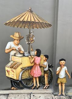 three children are standing in front of a street vendor with an umbrella on the side