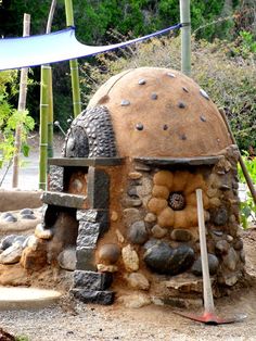 an outdoor oven made out of rocks and stones